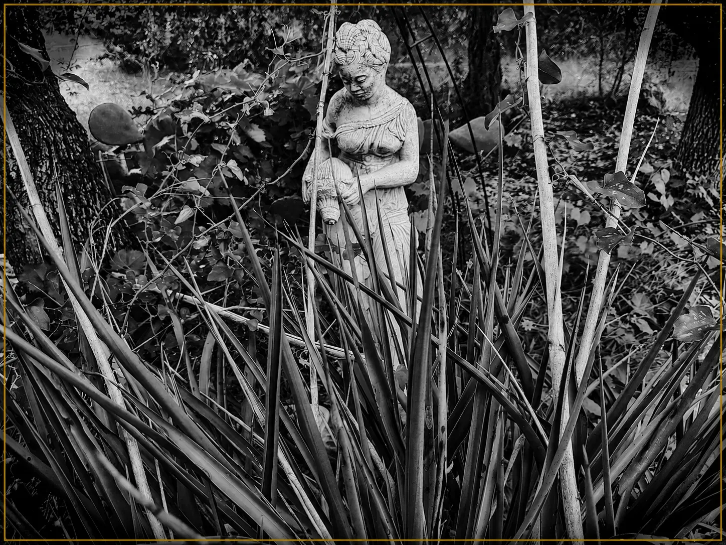 Garden statue among reeds