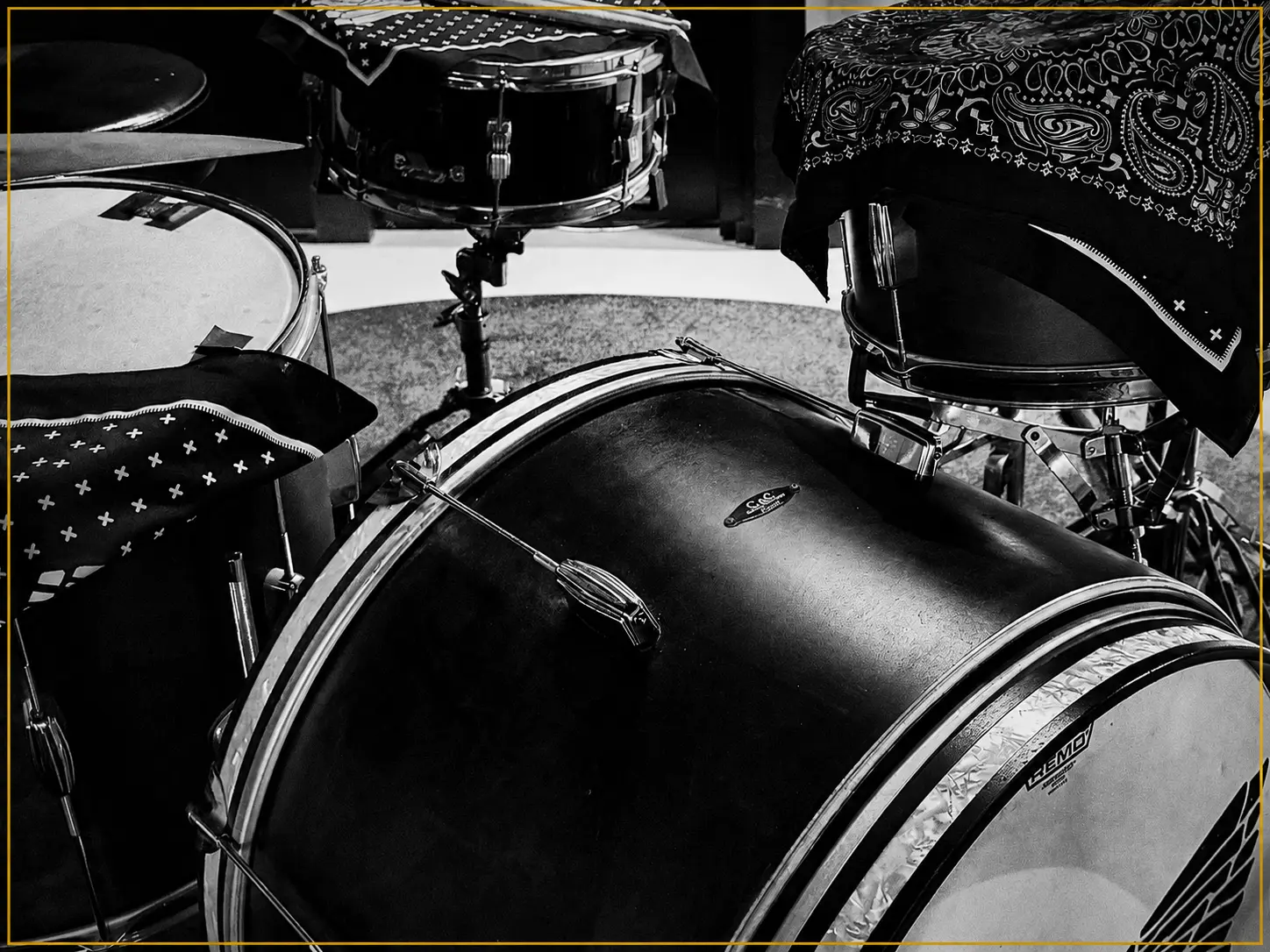Drum kit draped with bandanas